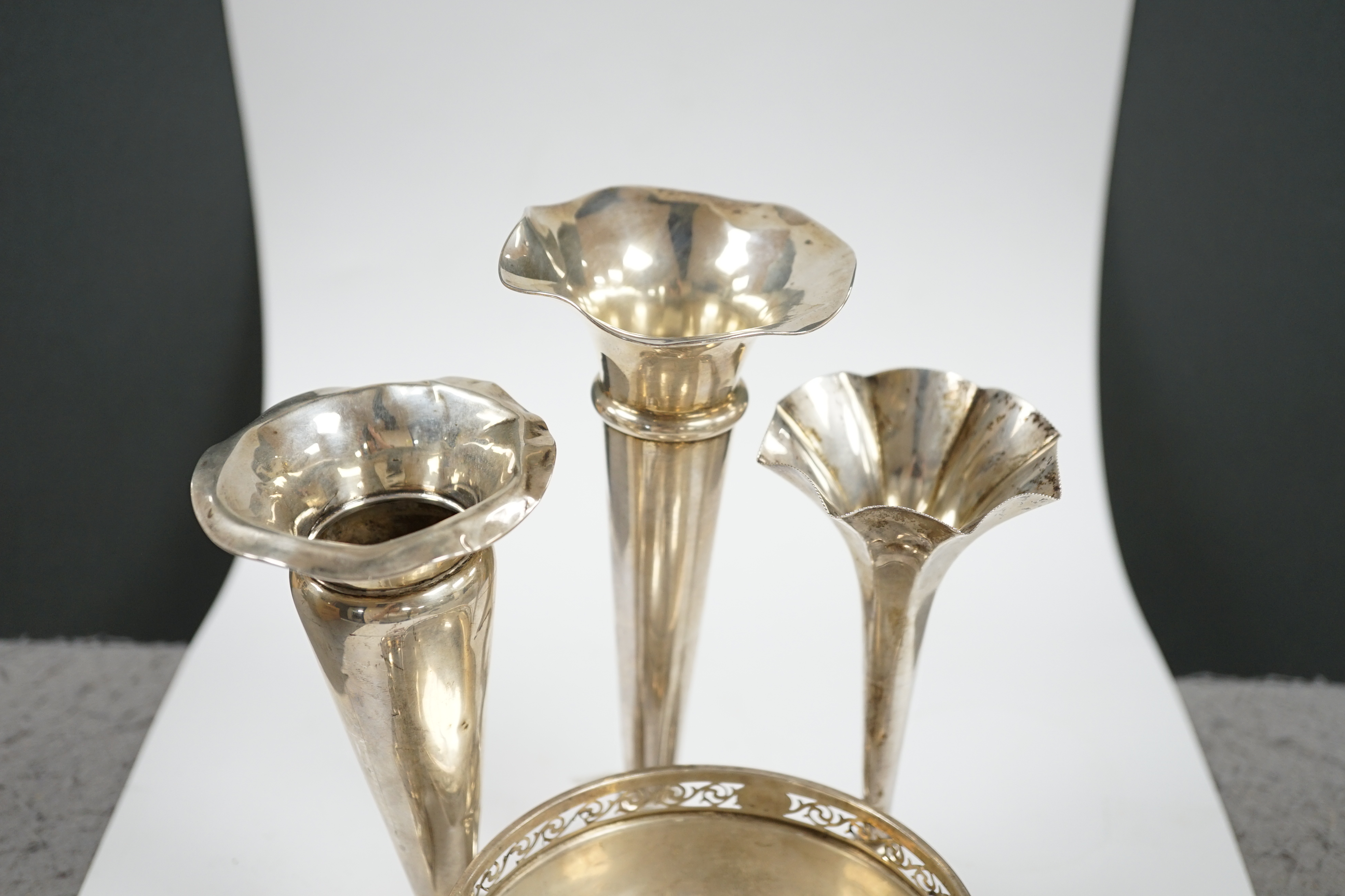 Three assorted silver mounted posy vases, tallest 20cm, five assorted silver condiments and a silver bowl. Condition - poor to fair